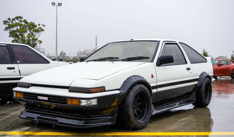 day, rain, no people, Panda Trueno, white, road, water, land vehicle, environment, Japanese cars, speed, trueno, tire, Toyota AE86, nature, sky, car, door