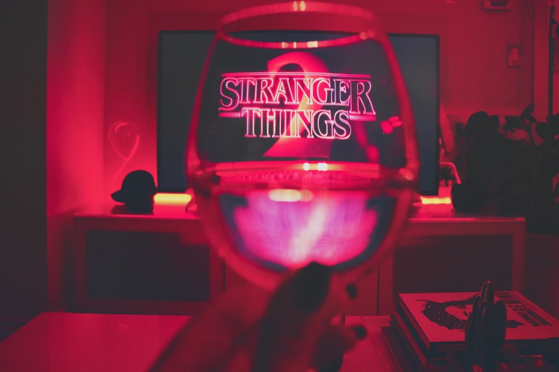 neon, communication, message, stranger thing, wine glass, sign, technology, red, restaurant, indoors, glass, tv show, blood, tv, built structure, glass - material