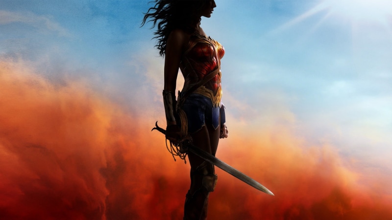 woman, Wonder Woman, action, sign, smoke - physical structure, Film posters, cloud - Sky, one Person, outdoors, courage, day, weapon, extreme Sports, holding