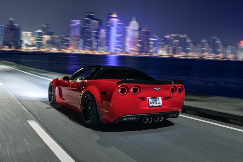 red, motor vehicle, building exterior, chevy, night, motion, land vehicle, no people, mode of transportation, 720P, architecture, built structure, street