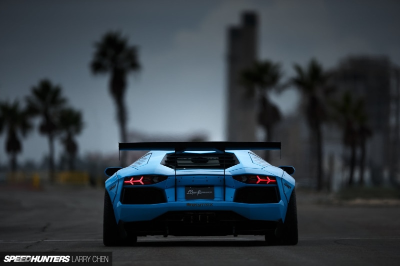 treelined, transportation, car, nature, luxury, palm tree, road trip, city, sunset, tree, Lamborghini, stationary, text, focus on foreground, road, overlay