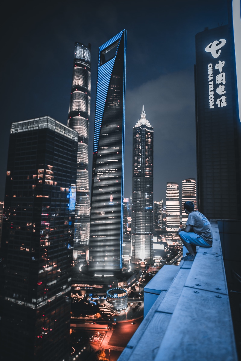 office building, roof, night, office building exterior, built structure, high rise, human, neighborhood, modern, steeple, tall - high, metropolis, building exterior