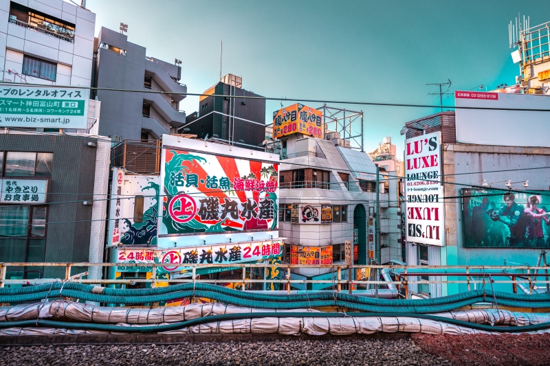 outdoors, communication, advertisement, road, day, billboard, town, building, built structure, 8K, graffiti, sky, no people, track, art, neighborhood