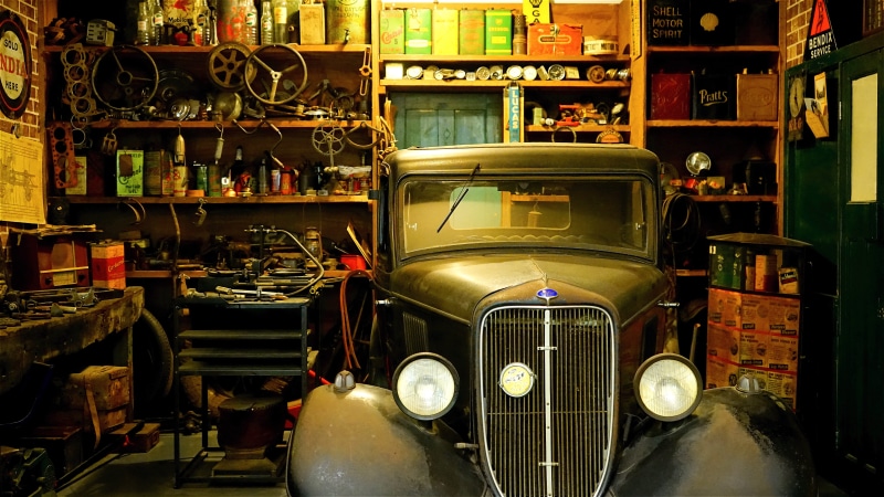 large group of objects, mechanical, black, garage, transportation, car repair, repairman, shopping, mode of transportation, city, motor, tool, inspection