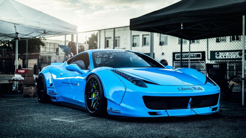 luxury, automotive design, sports car, luxury vehicle, city, blue, mode of transportation, parking, race car, outdoors, transportation, no people, supercar