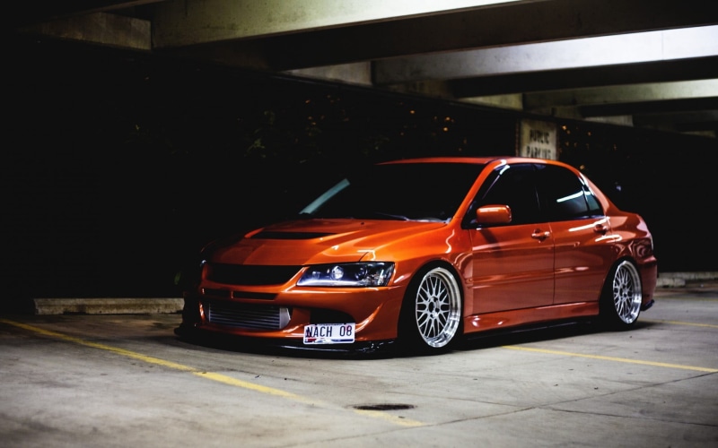1080P, parking garage, car, parking lot, mode of transportation, day, Mitsubishi, land vehicle, parking, Mitsubishi Lancer, city, street, architecture