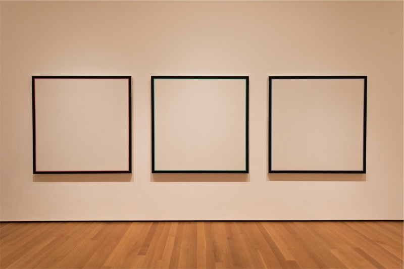 collection, paintings, wood - Material, art gallery, flooring, wall, no people, hardwood floor, blank, frame, three, canvas, boxes, empty, indoors, picture frame