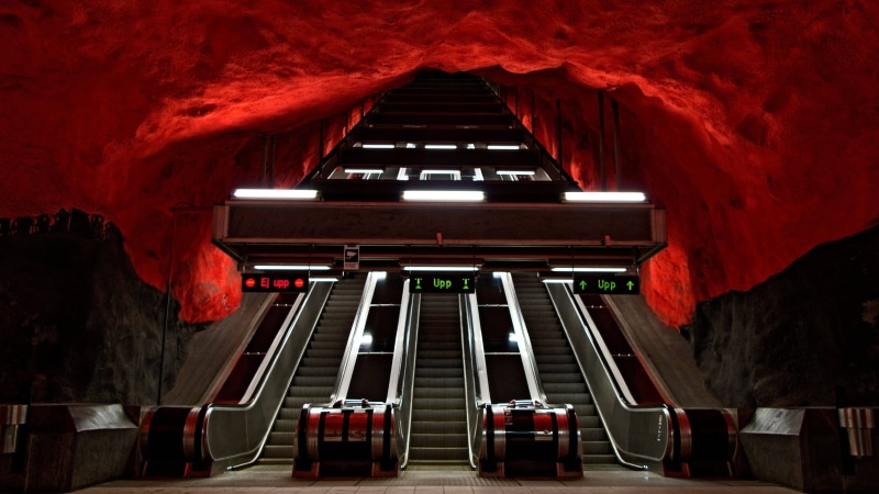 Stockholm metro, tunnel, escalators, architectural column, low angle view, red, architecture, illuminated, day, indoors, tourism, arts culture and entertainment