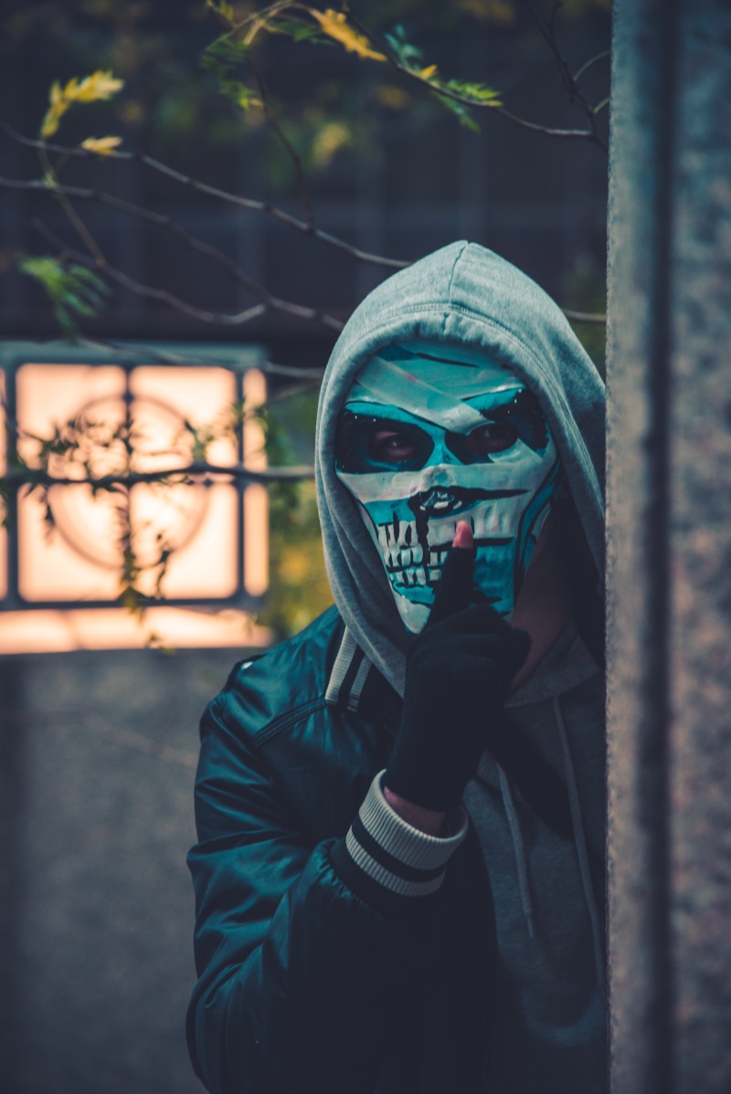 one person, wall, wire, portrait, disguise, mask - disguise, mask, obscured face, beside, barbed, outdoors, leisure activity, man, halloween, holding, lifestyles