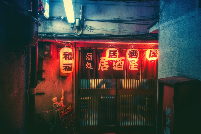 architecture, text, kanji, communication, western script, wall, lighting equipment, night, lighted, indoors, illuminated, business, town, entrance, building