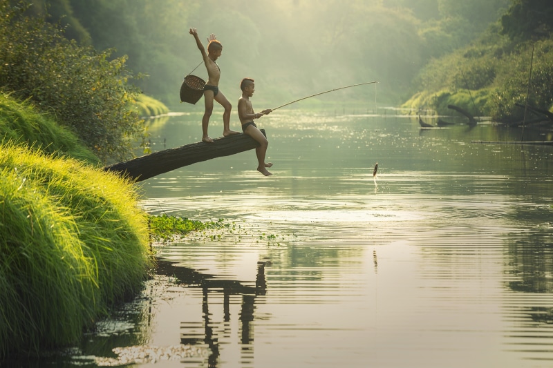 outside of the house, myanmar burma, as children, sky, fishing, people, the sun, two people, sea, full length, prey, real people, background, country malaysia