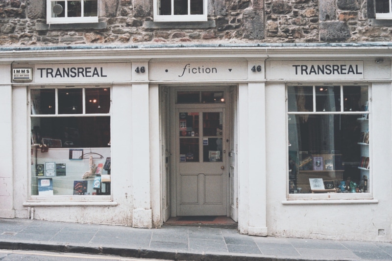 literature, bookshop, retail, glass - material, outdoors, edinburgh, science fiction, business, western script, day, minoltum, store, film, cafe, bookstore