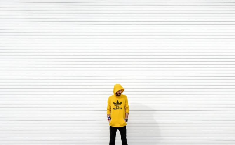 raincoat, three quarter length, whistle, minimalist, stage, wall - building feature, real people, french door, white, 2K, text, young adult, one person