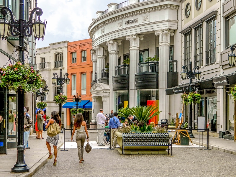 street, tourist, city, facade, real people, top, boutique, luxury, cafe, road, daytime, architecture, urban Scene, built Structure, adult, sleeveless, lifestyles