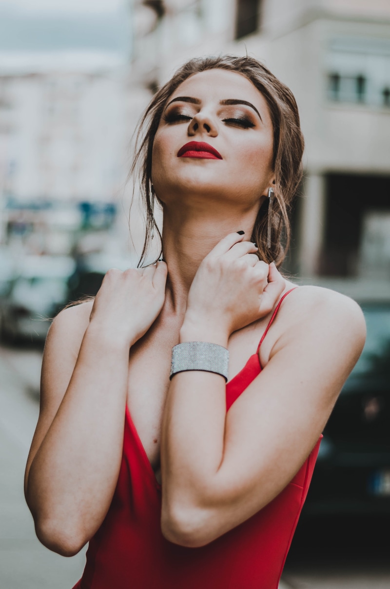red, female, black, front view, blonde hair, hot girl, neck, eyes, fashion, waist up, architecture, one person, building, standing, beauty, girl, adult