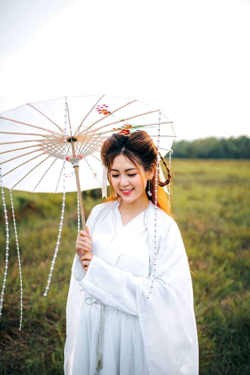 lipstick, grass, standing, one person, kimono, red, brunette, holding, girl, outdoors, three quarter length, bead, traditional, outdoor, wearing, young