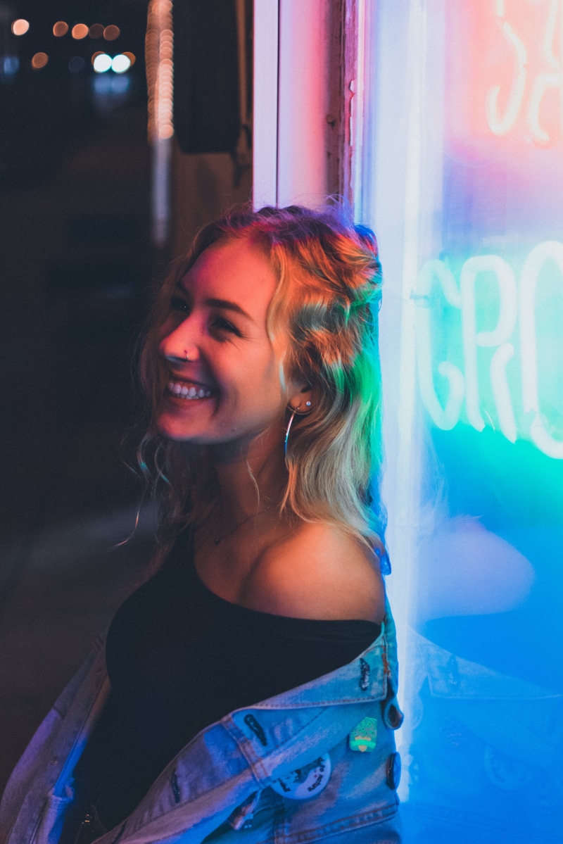 lifestyles, leisure activity, piercing, adult, hair, neon sign, signage, city, beautiful woman, shirt, window, lady, urban, one person, hairstyle, young women