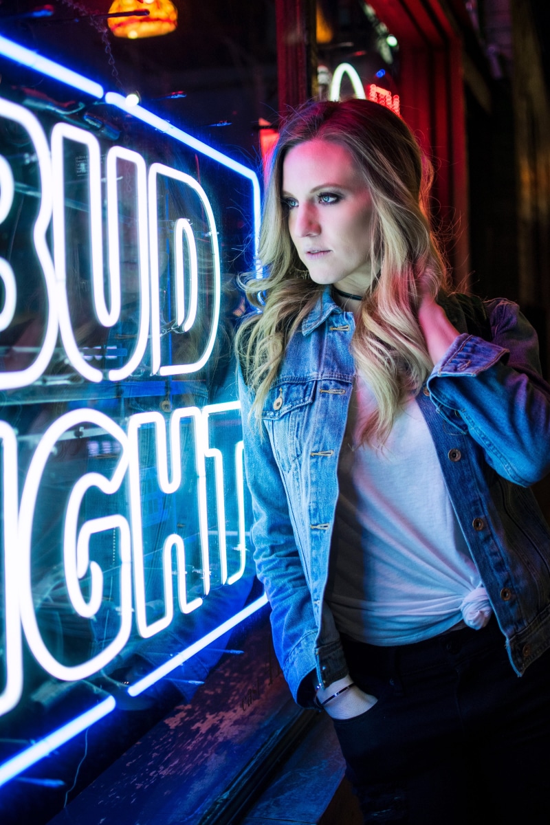 human, button, portrait, hairstyle, blonde hair, window, long hair, light, blue, women, signage, jacket, des moines, person, adult, beautiful woman, white