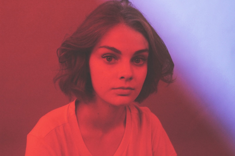 human hair, studio shot, serious, beautiful woman, eyes, red light, v, blue, headshot, hair, neon light, art, fashion, wearing, red neon, women, red, one person