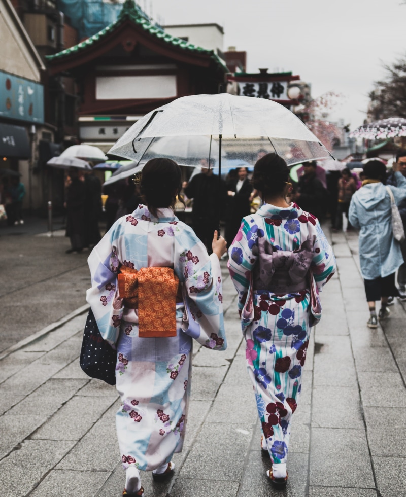 village, traditional, built structure, rain, two, city, town, footpath, girl, clothing, incidental people, people, paveway, rear view, woman, men, women
