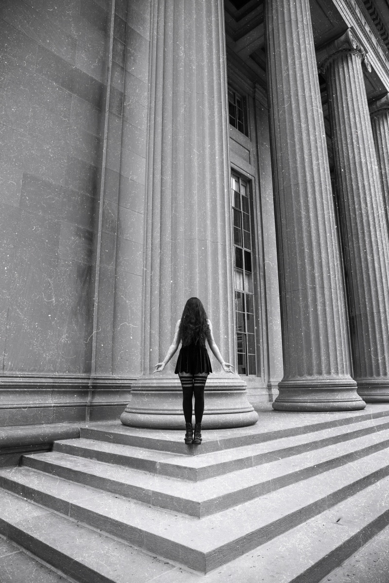monochrome, hairstyle, casual clothing, building, lady, warm clothing, steps, front, city, stockings, architecture, eery, anonymous, urban, adult, outdoors
