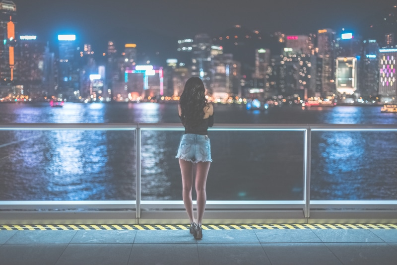 tiled floor, beautiful woman, watching, skyscraper, outdoors, woman, office building exterior, looking at view, rear view, night, evening, architecture