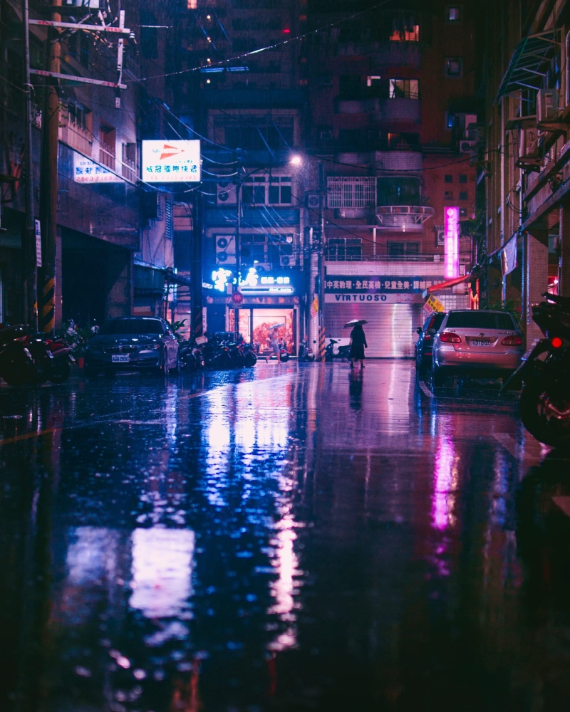 transportation system, building, city, water, rain, buildings, light, road, street, purple, real people, illuminated, urban, walking, neon, outdoors, transportation