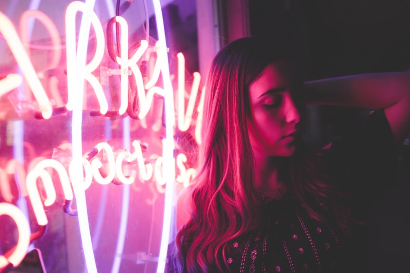text, 5K, illuminated, light, street, nighttime, photography, leisure activity, neon, pink color, woman, one person, real people, dead, hairstyle, night