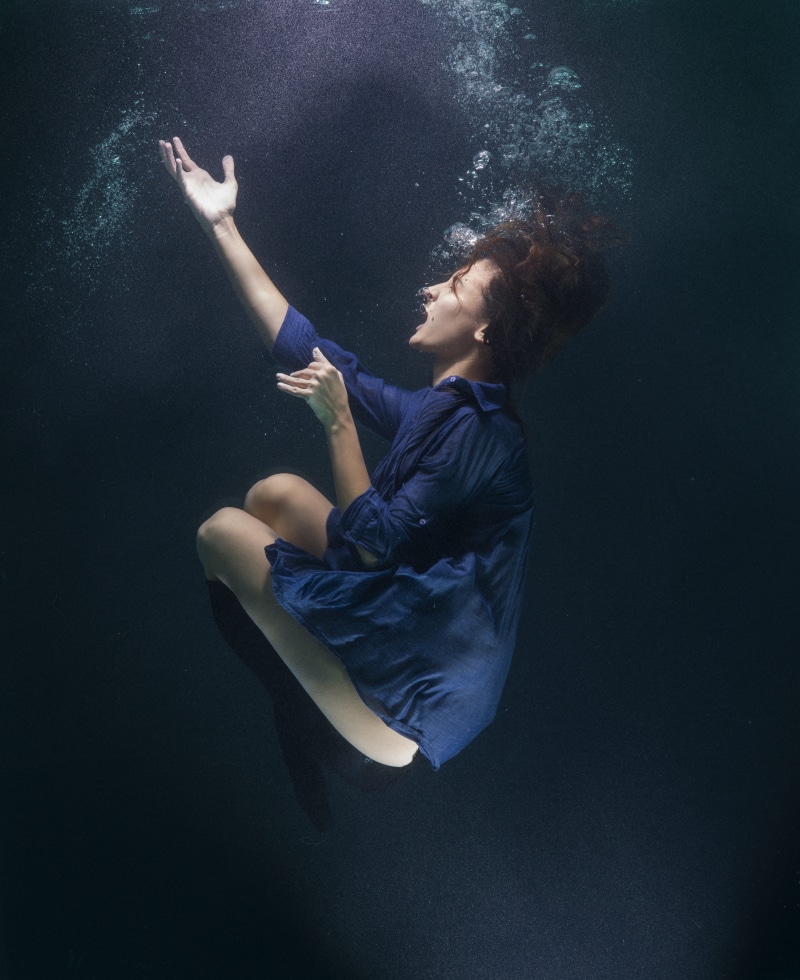 sport, real people, sitting, casual clothing, under water, right hand, raising, mini, wearing, young model, photography, young adult, one Person, full length