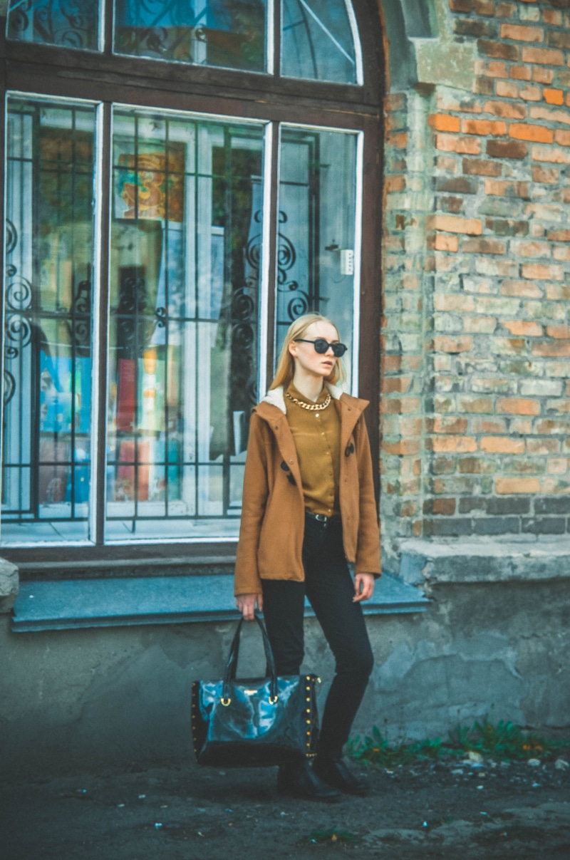 leather, black, casual Clothing, holding, hands, girl, street, real people, girls, woman, style, day, smiling, city Life, front view, hair, full length