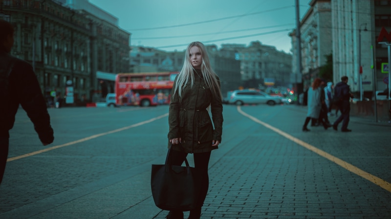 hairstyle, incidental people, urban Scene, studio, front view, road, girl, standing, building exterior, gum, street, posture, hair, beautiful woman, pants