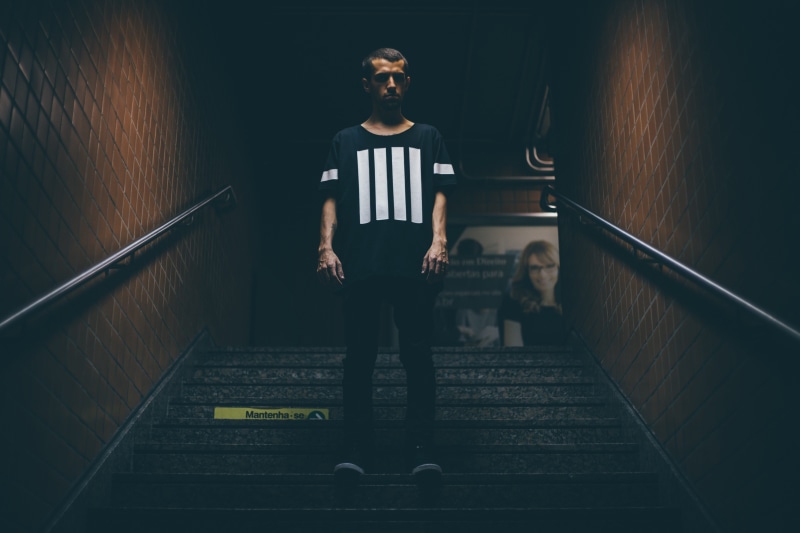 people, shadow, black and white, white, shirt, real people, solitude, standing, model, boy, city, women, staircase, lifestyles, building, casual clothing