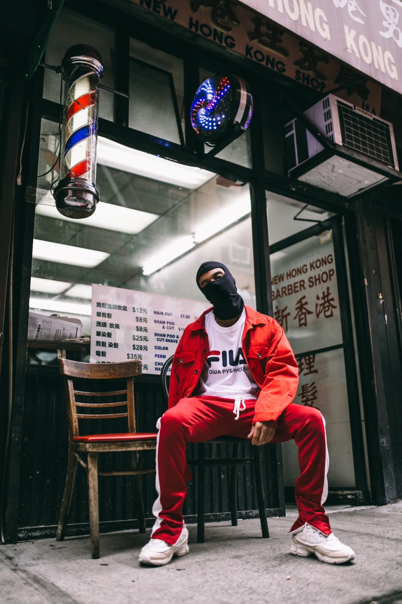 real people, communication, sitting on chair, men, code, standing, portrait, text, man, uniform, shop window, fashion, sign, full length, built structure