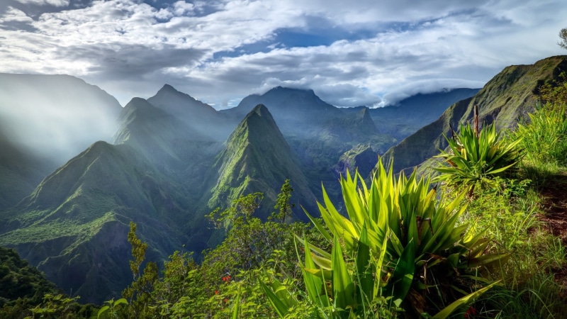 formation, no people, mountain range, green color, tree, environment, remote, day, cloud - sky, outdoors, nature, plant, non-urban scene, sky, beauty in nature
