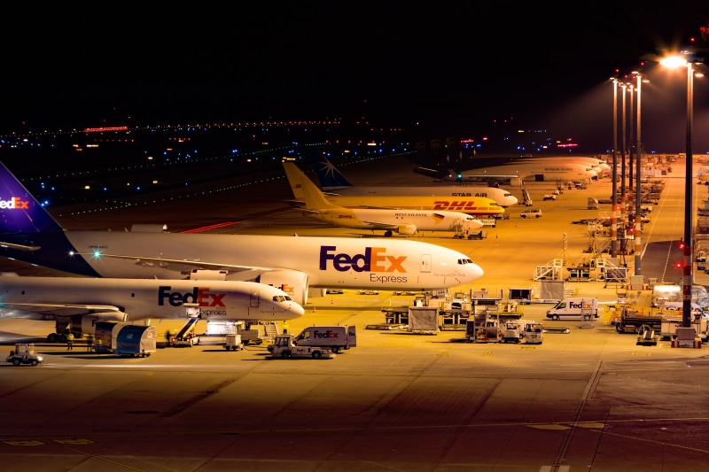 airliner, mode of transportation, no people, flying machine, road, travel plane, light, illuminated, Airport, motor vehicle, fedex, built structure, air