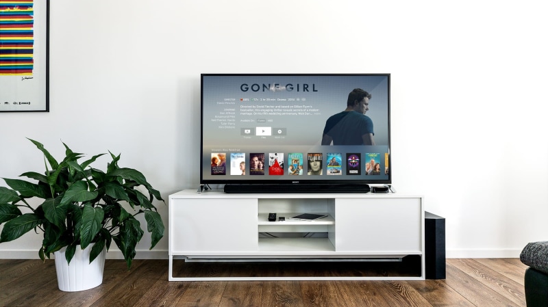TV, flooring, on top, smart television, wooden, home Interior, media center, no people, computer, wood - material, nature, turned on, modern, stand, table