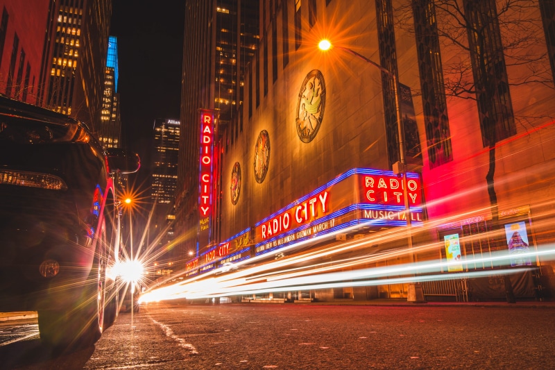 illuminated, radio city, motion, speed, new york, city life, skyscraper, road, long exposure, office building exterior, light, city street, vehicle, street