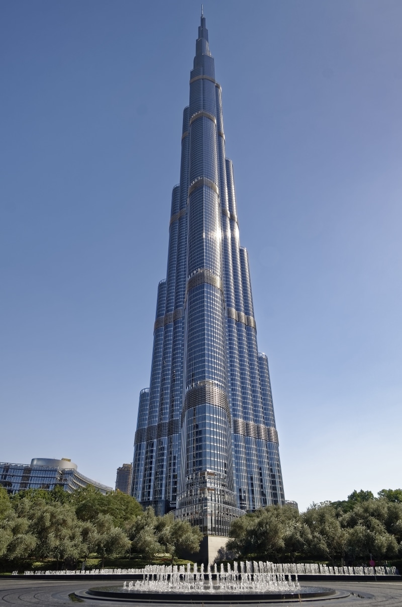 architecture, outdoors, clear sky, modern, u a e, tower, no people, low angle view, burj khalifa, day, tall - high, city, plant, skyscraper, nature, office