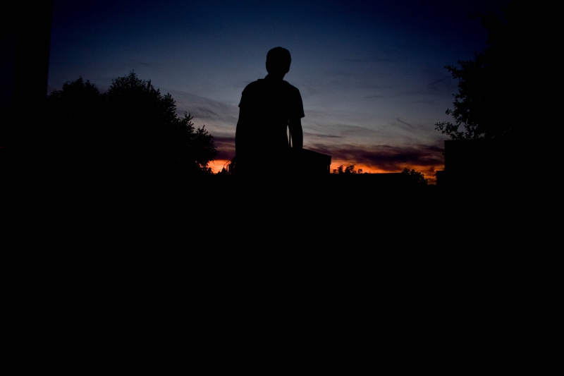 sun, lifestyles, orange, three quarter length, outdoors, nature, sunset, twilight, sky, leisure activity, man, plant, tree, dusk, person, dark, standing