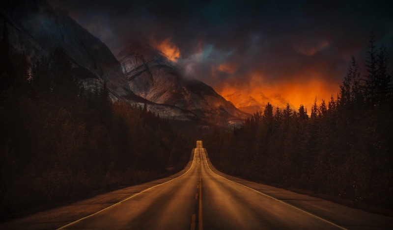 transportation, beauty in nature, road, land, forest, pine trees, snowy peak, sunset, mountains, mountain, the way forward, sky, cloud - sky, empty, no people