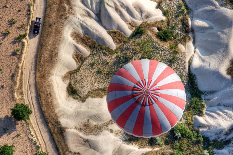 outdoors, directly above, nature, Cappadocia, plant, sand, road, high angle view, 1080P, balloon, creativity, sunlight, aerial view, hot, landscape, air