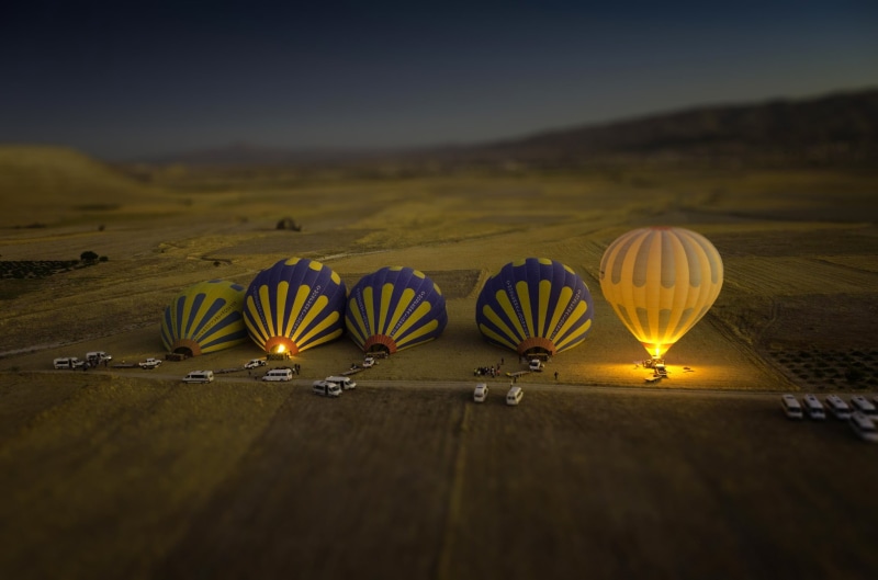 hills, basket, mountain, illuminated, yellow, leisure Activity, multi Colored, cultures, land, adventure, car, balloons, group of people, air, recreational Pursuit