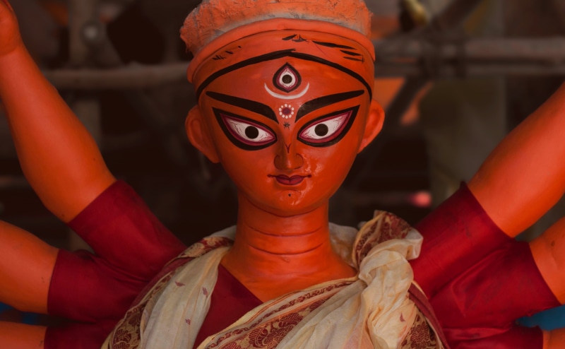 craft, red, godess, statue, creativity, durga, female likeness, human representation, maa, day, figurine, focus on foreground, 4K, indoors, male likeness