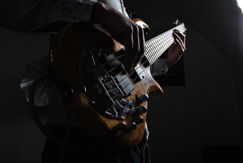 electric guitar, arts culture and entertainment, electric, string instrument, musical equipment, strings, one person, music, artist, standing, natural