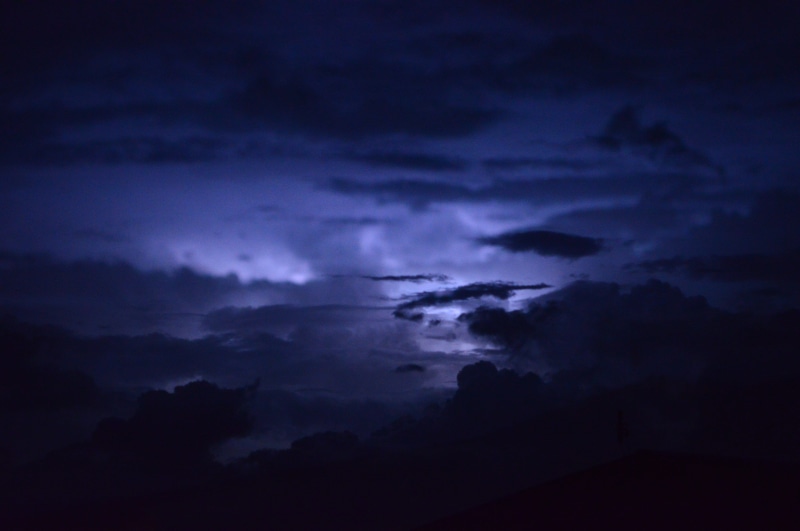 beauty in nature, silhouette, blue, cloudscape, dark, ominous, clouds, moody, weather, power in nature, nature, overcast, rain, outdoors, lightning, no people