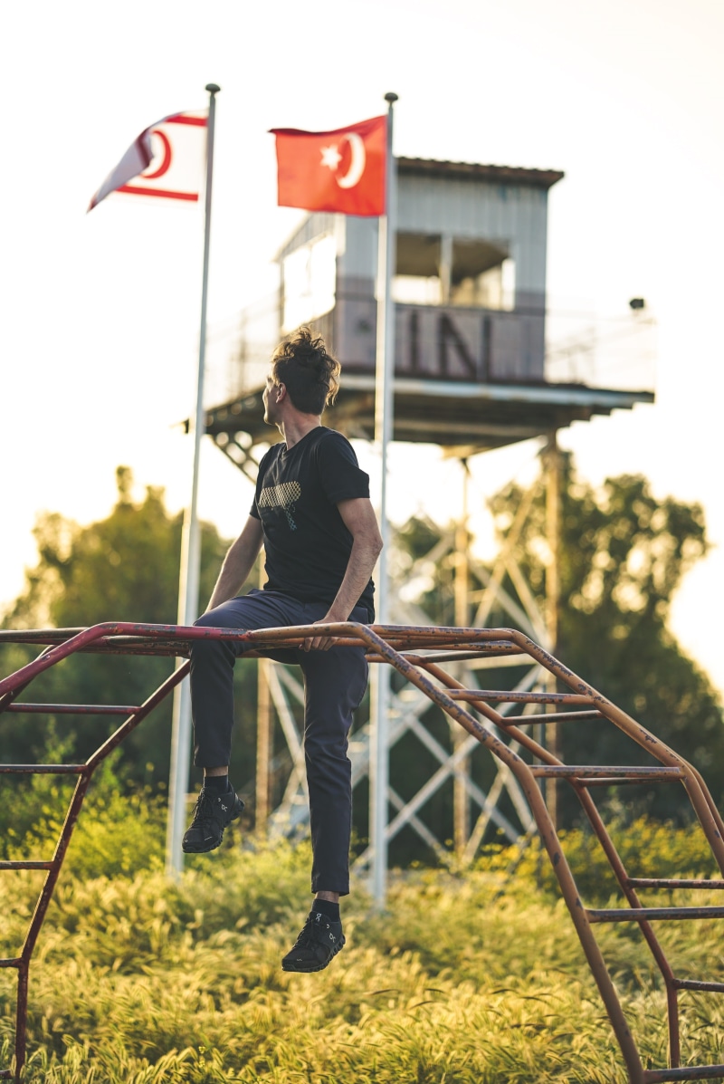 casual clothing, conquered, structure, post war period, watchtower, sky, tower, military, turkish cyprus, architecture, landmark, crew, built structure