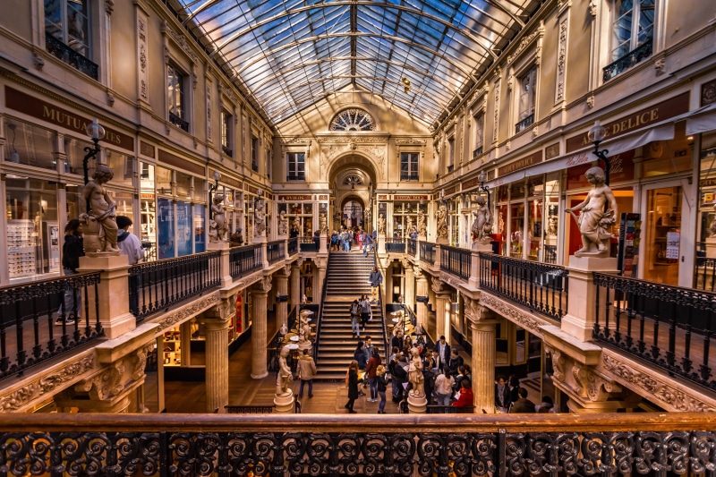city, colors, crowd, consumerism, large group of people, architecture, lots, group of people, incidental people, mall, france, walking, adult, men, book