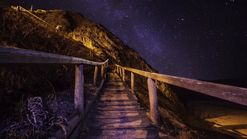 outdoors, phenomenon, built structure, no people, tranquil scene, stars, wood - material, milky way, beauty in nature, space, tranquility, footbridge, sky
