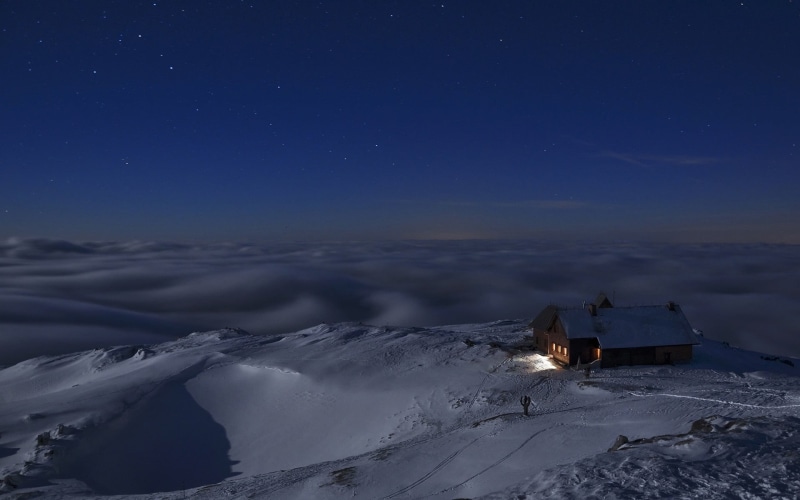 tranquil scene, environment, winter, clouds, brown, snow, outdoors, white, astronomy, night, mountain, cloud - sky, cottage, Slovenia, starry night, house