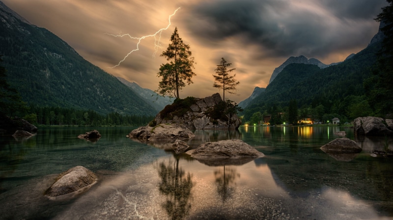 gray, beauty in nature, tranquil scene, Slovenia, scenics - nature, tree, lightning, clouds, cloud - sky, water, lake, tranquility, mountain, plant, rock - object